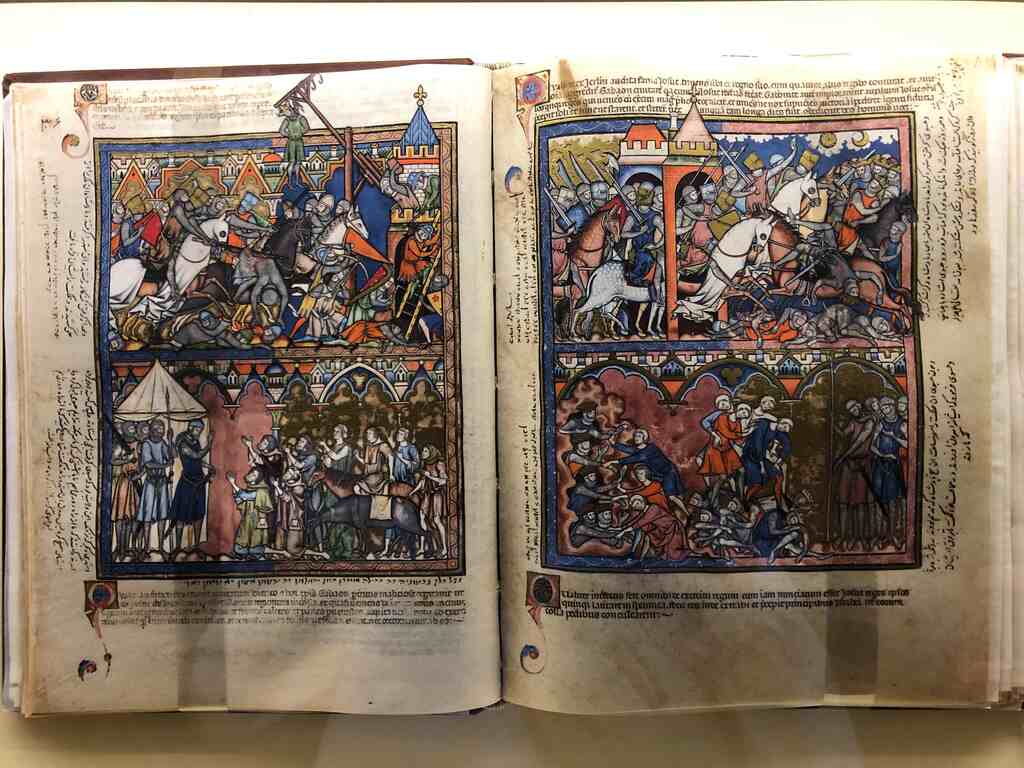 Eine Doppelseite eines mittelalterlichen Buchs in der Szenen einer Ritterschlacht abgebildet sind